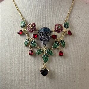 Gold Skull and Rose Necklace with Red and Green Accents